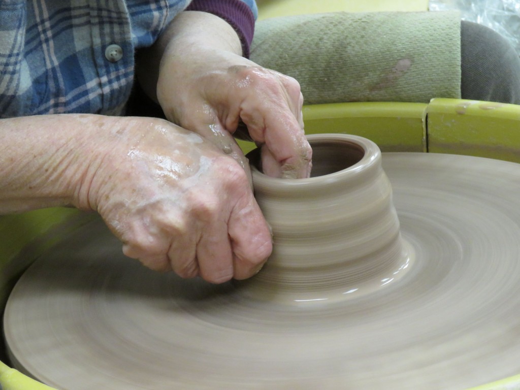 The current image has no alternative text. The file name is: hands-on-pottery-wheel.jpg