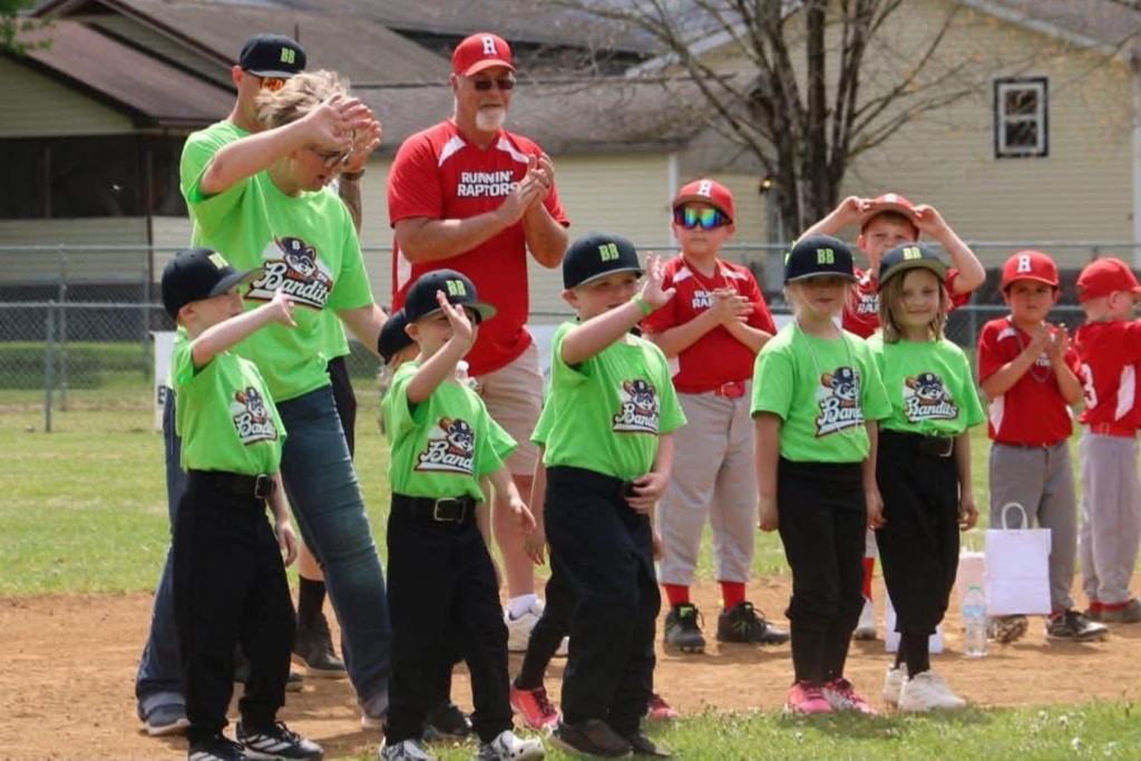 The current image has no alternative text. The file name is: wgll-kids-waving-scaled.jpg