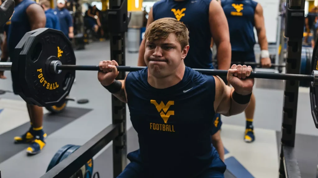 The current image has no alternative text. The file name is: wvu-football-lifting.webp